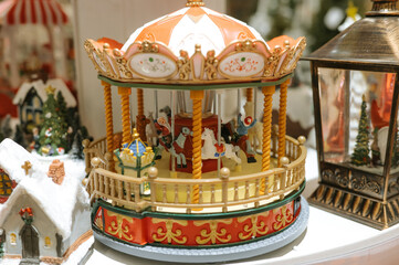 Vintage miniature carousel with horses and decorative details