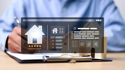 Person using digital tablet and laptop with virtual real estate interface, featuring house icon, rating stars, documents, and property checklist. Concept of smart property management.