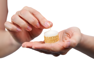 Closeup of hands holding a small decorative candle isolated on transparent background