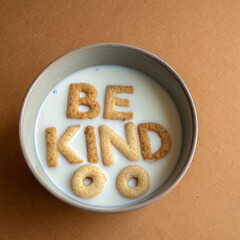 Creative bowl of cereal with letters spelling out a kind message in milk