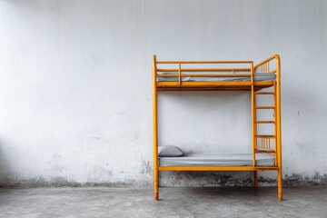 Bright yellow metal bunk bed stands against a distressed white wall with concrete floor