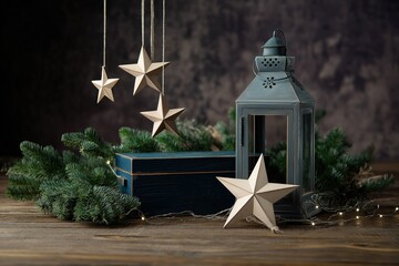 Vintage ice skating scene with star-shaped wooden ornaments, dark blue box, and green pine branches on wooden floor, moody lighting for portrait studio backdrop and winter decor.