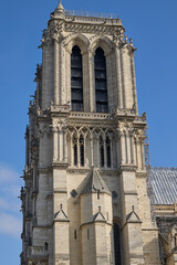 Fototapeta premium Close-up view of the south tower of Notre Dame Cathedral in Paris, France, showcasing Gothic architecture and stone details.