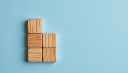 Colorful Wooden Blocks Arranged Creatively on Blue Background for Fun Play and Learning Activities