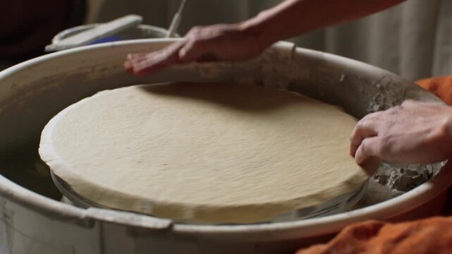 Creating beautiful ceramic art with skilled pottery hands in a studio