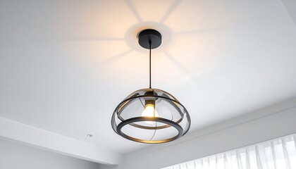 Modern pendant light fixture illuminating a bright room.