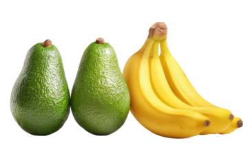 Two avocados stand beside a bunch of ripe bananas. Black background. Perfect for food styling