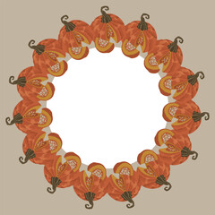 Wreath of pumpkins made from ripe multicolored pumpkins on a beige background