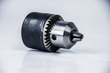 Steel Drill chuck head 13 mm, maintenance electric tools, accessory gear, studio photography shot, isolated on white background, photo is selective focus, shallow depth of field, taken at Cairo Egypt