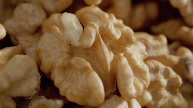 This close-up shot showcases the intricate details and unique texture of a walnut kernel. The rich colors and shapes reveal the beauty of this nut's structure.