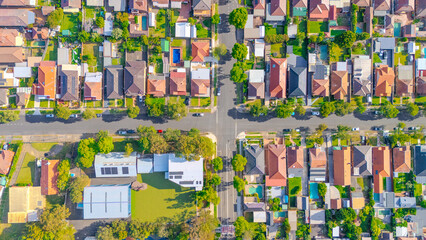 Fototapeta premium Aerial Panorama Drone View of a inner western Sydney Suburb of Ashbury Urban Sprawl and the terracotta roof tops streets and trees of Suburban Sydney NSW Australia