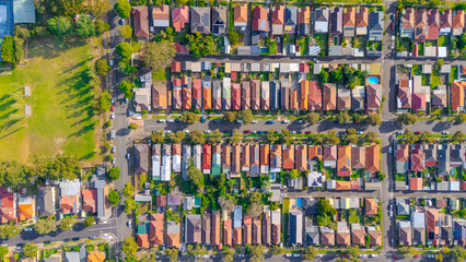 Fototapeta premium Aerial Panorama Drone View of a inner western Sydney Suburb of Ashbury Urban Sprawl and the terracotta roof tops streets and trees of Suburban Sydney NSW Australia