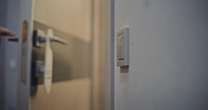 Close Up of Hotel Room Door Being Unlocked With Key Card. Female Hands Tapping Plastic Key Card on Electronic Door Lock Hotel Room Entrance. Concept of Modern Access Control, Hospitality Technology.