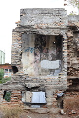Crumbling Brick Wall of Abandoned House