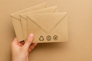 Eco-friendly mailing solutions sustainable envelopes for businesses office minimalist design close-up
