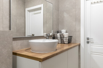 Contemporary Bathroom with Wooden Countertop and White Basin