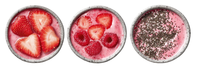 Three bowls of pink smoothies, each topped differently with berries or chia seeds