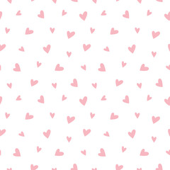 Seamless pattern of pink hearts on a white background. A small symbol, a sign of love. Romantic background pattern template for holiday, design, fabric, wrapping paper, valentine, wedding