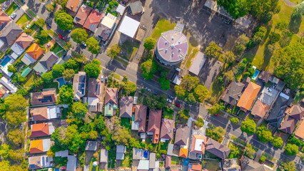 Fototapeta premium Aerial Panorama Drone View of a inner western Sydney Suburb of Ashbury Urban Sprawl and the terracotta roof tops streets and trees of Suburban Sydney NSW Australia