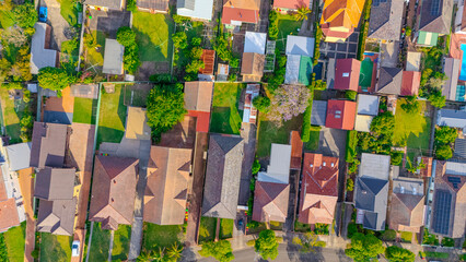 Fototapeta premium Aerial Panorama Drone View of a inner western Sydney Suburb of Ashbury Urban Sprawl and the terracotta roof tops streets and trees of Suburban Sydney NSW Australia