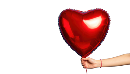 A hand holds a shiny, bright red heart-shaped balloon against a stark black background, symbolizing love