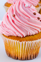 A delicious layered cake is topped with fresh raspberries and blackberries, showing vibrant colors and contrasting textures.