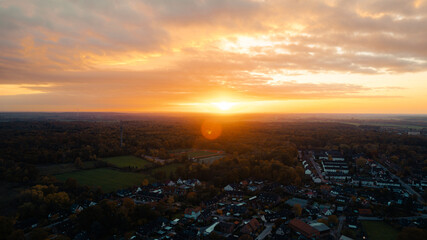 Aerial Sunset View over a Small Town Surrounded by Forest, Germany
