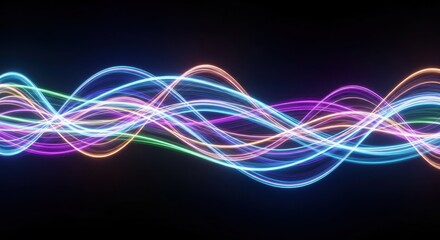 Vivid multicolored light trails flowing against a dark background illustrating digital data or