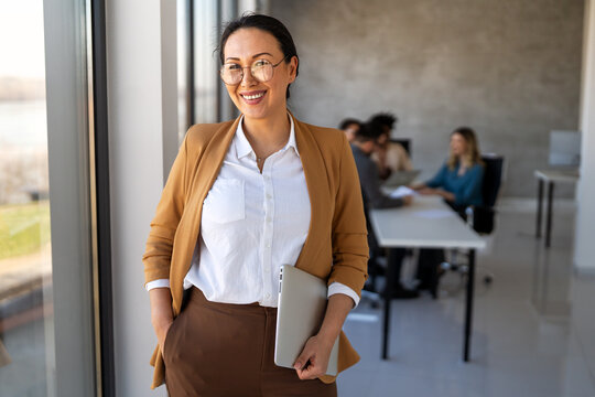 Fototapeta Multicultural professional businesspeople working together on research plan in boardroom.