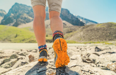 womans foot steps, hiking in the mountains, close up
