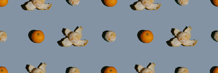 Tangerines seamless pattern on a blue background