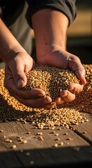 Close-up of hands holding and pouring a mixture of grains or seeds onto a wooden surface outdoors in natural sunlight