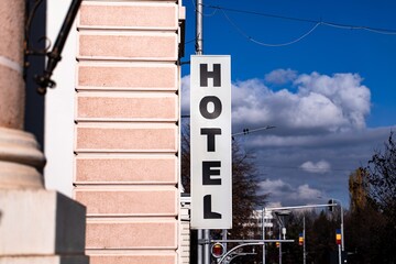 Close-up of a hotel sign in B&acirc;rlad, showing the name and exterior branding of the building, captured in daylight.