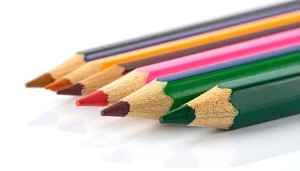 Close-up of colorful pencils arranged in a row on white background.