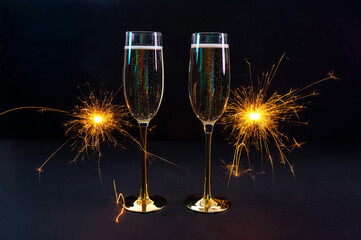 Happy New Year 2026, New Year's Eve holiday greeting card celebration. Sparklers firework,...