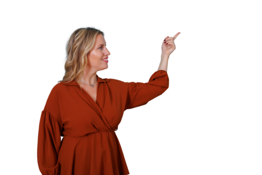 Smiling woman pointing finger upwards and looking sideways to the right, showing and presenting information on transparent background - Powered by Adobe