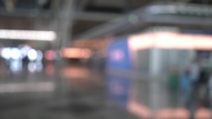 Interior view of airport terminal with traveler motion