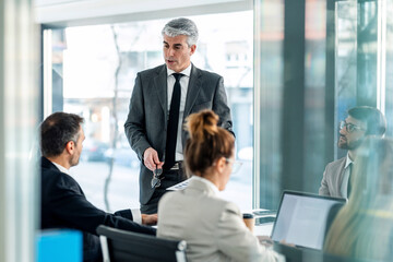 Executive leading team brainstorming session in office meeting