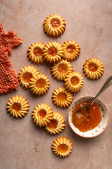 yellow cookies  flowers on a rose background
