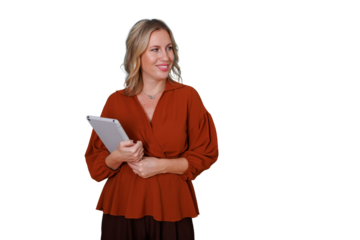 Young businesswoman smiling, standing while holding a digital tablet. Representing modern work, technology, leadership, and success