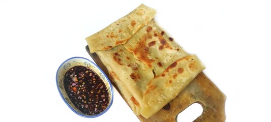 Martabak Telor with Soy Sauce Served On a Plate. Traditional Indonesian Street Food. Food Photography Presentation. Isolated on White Background