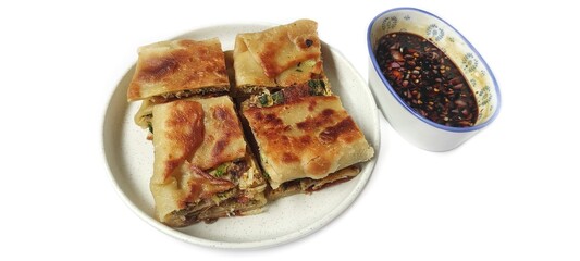 Martabak Telor with Soy Sauce Served On a Plate. Traditional Indonesian Street Food. Food Photography Presentation. Isolated on White Background