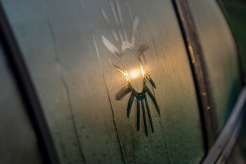 Sun reflection on car glass.