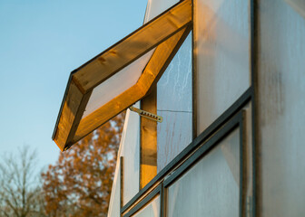 Opened window of a greenhouse.