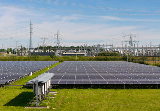 Solar farm with power lines and transformer station in the Netherlands