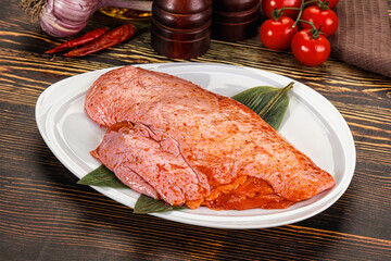 Raw marinated duck breast for cooking