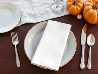 Elegant autumn dinner table setting for holiday feast or gathering
