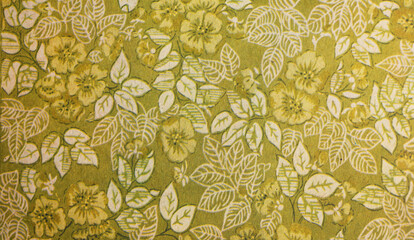 Old wallpaper on the wall. Old wallpaper for texture or background.