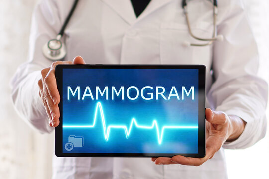 mammogram. medical concepts. female doctor with the word written on the screen of a digital tablet