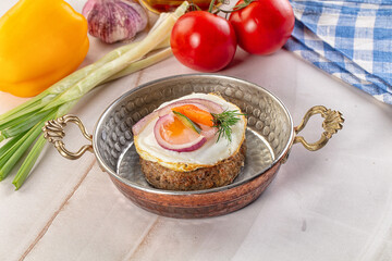 Beefsteak chop with roasted egg
